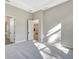 Spacious bedroom with carpet and access to the bathroom at 1062 Liliana Dr, Deland, FL 32724