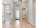 Bright and airy entryway with light hardwood flooring at 1062 Liliana Dr, Deland, FL 32724