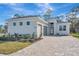 Single-story home with two-car garage and paver driveway at 1062 Liliana Dr, Deland, FL 32724