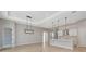 Modern kitchen with an island and high-end light fixtures at 1062 Liliana Dr, Deland, FL 32724