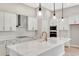Modern kitchen features stainless steel appliances and white cabinetry at 1062 Liliana Dr, Deland, FL 32724