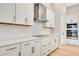 White cabinets, quartz countertops, and stainless steel appliances at 1062 Liliana Dr, Deland, FL 32724