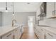 Open concept kitchen with island and views to backyard at 1062 Liliana Dr, Deland, FL 32724