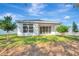 New home with covered patio and grassy backyard at 1062 Liliana Dr, Deland, FL 32724