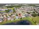 Aerial view of home near a lake and park at 11815 Pethrick Dr, Orlando, FL 32824