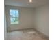 Well-lit bedroom with a large window and view at 1421 Arbor Hill Dr, Deltona, FL 32725