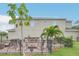 Outdoor patio area with seating and fire pit, surrounded by a fence at 15787 Avenue Of The Arbors, Winter Garden, FL 34787