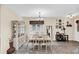 Dining room with light wood table and hutch at 15787 Avenue Of The Arbors, Winter Garden, FL 34787