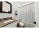 Bathroom with granite countertop and shower at 1630 W New York Ave, Orange City, FL 32763