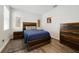 Bedroom with wooden furniture and neutral color scheme at 1630 W New York Ave, Orange City, FL 32763