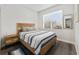 Bedroom with wood bed frame and striped bedding at 1630 W New York Ave, Orange City, FL 32763