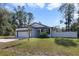 Exterior of house with white siding and garage at 1630 W New York Ave, Orange City, FL 32763