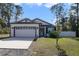 Newly built home with a two-car garage and landscaped front yard at 1630 W New York Ave, Orange City, FL 32763