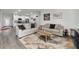 Spacious living room with two sofas and a view of the kitchen at 1630 W New York Ave, Orange City, FL 32763