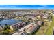 Aerial view showcasing townhouses and a lake in a residential area at 1927 Chatham Place Dr, Orlando, FL 32824