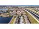 Aerial view of townhouses near lake, highway, and community amenities at 1927 Chatham Place Dr, Orlando, FL 32824