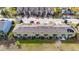 Aerial view of townhouse roofs and a residential street at 1927 Chatham Place Dr, Orlando, FL 32824