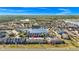 Aerial view of townhouses by a lake in a quiet community at 1927 Chatham Place Dr, Orlando, FL 32824