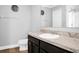 Clean bathroom with dark vanity, granite countertop, and a large mirror at 1927 Chatham Place Dr, Orlando, FL 32824