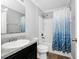 Clean bathroom with a tub, shower, and updated vanity at 1927 Chatham Place Dr, Orlando, FL 32824