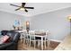 Bright dining room with hardwood floors and white farmhouse table at 1927 Chatham Place Dr, Orlando, FL 32824