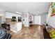 Bright and airy entryway with hardwood floors and views into the living area and kitchen at 1927 Chatham Place Dr, Orlando, FL 32824