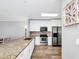 Modern kitchen with stainless steel appliances and granite countertops at 1927 Chatham Place Dr, Orlando, FL 32824