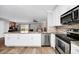 Open concept kitchen with stainless steel appliances and granite counters at 1927 Chatham Place Dr, Orlando, FL 32824
