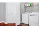 Laundry room with washer, dryer, and storage at 1927 Chatham Place Dr, Orlando, FL 32824
