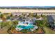 Community pool with surrounding landscaping and a cabana at 1927 Chatham Place Dr, Orlando, FL 32824