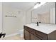 Modern bathroom with dark vanity, updated fixtures and tile at 1964 Lake Atriums Cir # 175, Orlando, FL 32839