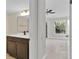 Modern bathroom with dark brown vanity and updated fixtures at 1964 Lake Atriums Cir # 175, Orlando, FL 32839
