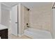 Clean bathroom with a bathtub and updated tile surround at 1964 Lake Atriums Cir # 175, Orlando, FL 32839