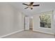 Bright bedroom with tile flooring and ceiling fan at 1964 Lake Atriums Cir # 175, Orlando, FL 32839