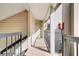 Exterior hallway leading to condo unit, well-lit at 1964 Lake Atriums Cir # 175, Orlando, FL 32839