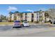 Two-story apartment building with ample parking and landscaping at 1964 Lake Atriums Cir # 175, Orlando, FL 32839