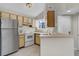 Kitchen with stainless steel appliances and light wood cabinets at 1964 Lake Atriums Cir # 175, Orlando, FL 32839