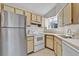 Bright kitchen featuring stainless steel appliances and ample cabinetry at 1964 Lake Atriums Cir # 175, Orlando, FL 32839