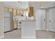 Galley kitchen with stainless steel appliances and light wood cabinets at 1964 Lake Atriums Cir # 175, Orlando, FL 32839