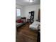 Bedroom with couch, bed, and wood floors at 2035 W Gore St, Orlando, FL 32805