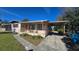 Charming ranch home with carport and mature landscaping at 2035 W Gore St, Orlando, FL 32805