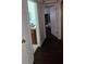 Hallway with carpet and doors to bathroom and bedroom at 2035 W Gore St, Orlando, FL 32805