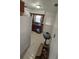 View of kitchen with wood cabinets and door to outside at 2035 W Gore St, Orlando, FL 32805