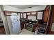 Galley kitchen with wood cabinets and appliances at 2035 W Gore St, Orlando, FL 32805