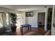 Living room with hardwood floors and a pool table at 2035 W Gore St, Orlando, FL 32805