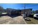 Side yard with basketball hoop and driveway at 2035 W Gore St, Orlando, FL 32805