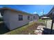 Side of home with small patio area at 2035 W Gore St, Orlando, FL 32805
