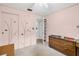 Bedroom with decorative closet doors, a dresser and a neutral carpet at 2712 Ceram Ave, Orlando, FL 32837
