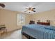 Bright bedroom featuring a double bed and a window with natural light at 2712 Ceram Ave, Orlando, FL 32837