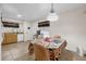 Kitchen with wood cabinets, tile flooring, and a dining area at 2712 Ceram Ave, Orlando, FL 32837